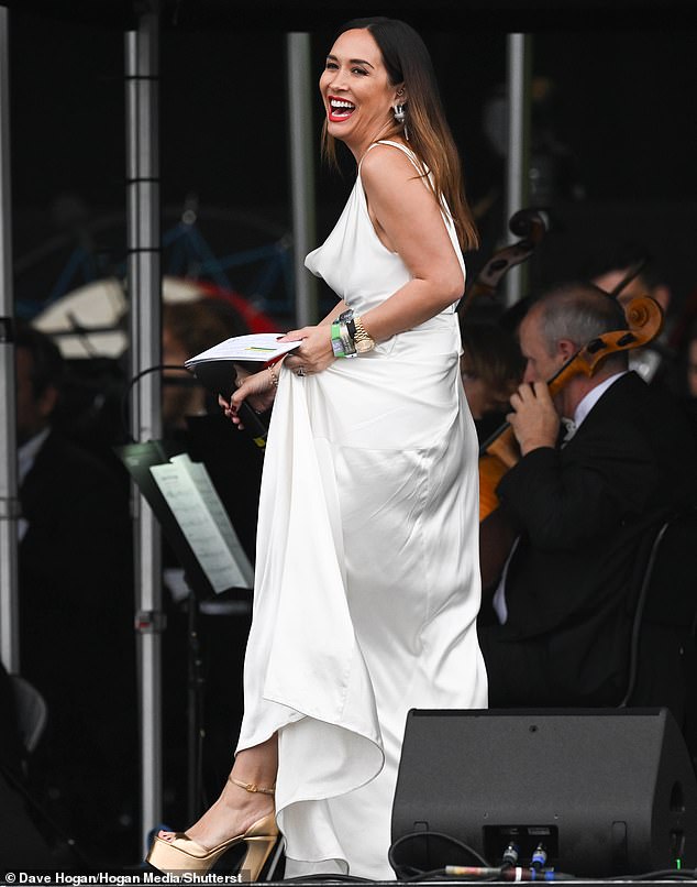 Myleene paired the dress with a turtleneck and gold platform heels and hiked up her dress as she walked across the stage