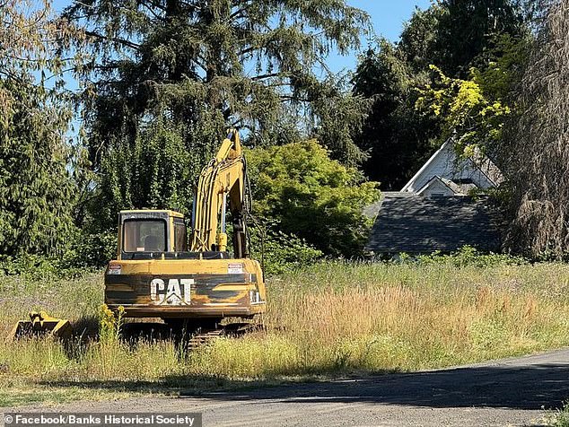 An excavator razed the 154-year-old, two-story building to the ground on Friday