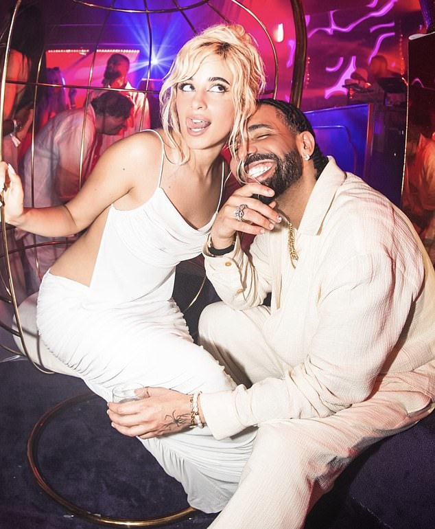 She was photographed chatting happily with rapper Drake, 37, at the party