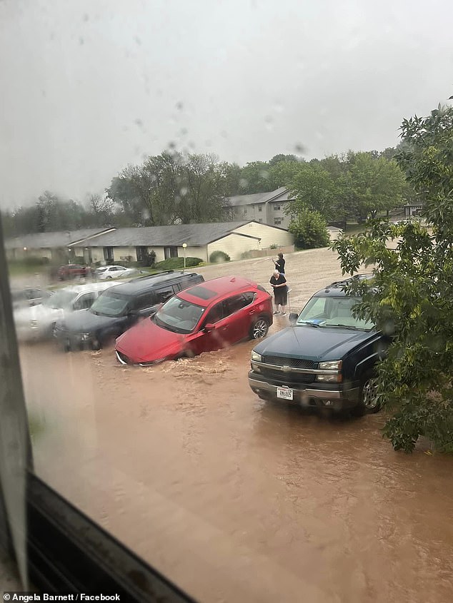 Several streets in the area are flooded and several cars are stuck on the highway