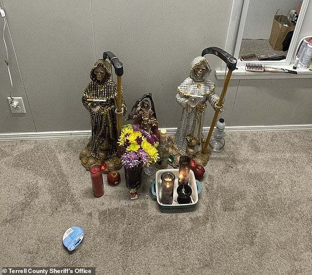 Apples, flowers, a bottle of tequila and cigarettes were left at the Fort Worth warehouse as offerings to Santa Muerte