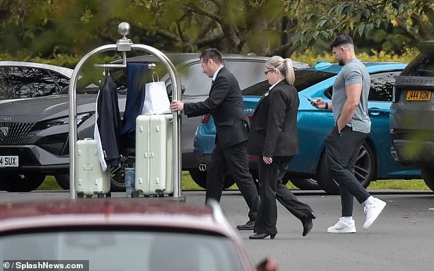 Meanwhile, her fiancé Tommy Fury, 25, watched over their luggage as he casually walked into the hotel