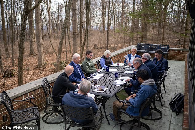 Biden likes to do prep work at Camp David — above, he and his team prepare for the State of the Union address at Camp David in March