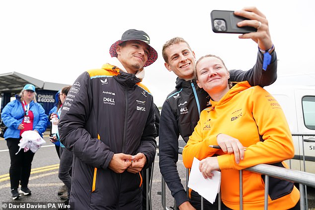 Norris (left) takes time to soak up the atmosphere around Silverstone during the race weekend