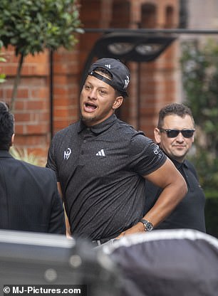 The Chiefs quarterback wore an Adidas golf shirt with his logo on it and a black cap