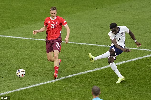 No one can question England's courage, their football is poor, but for the second game in a row they have scored a late goal - of real quality (Bukayo Saka, right, scores for England)