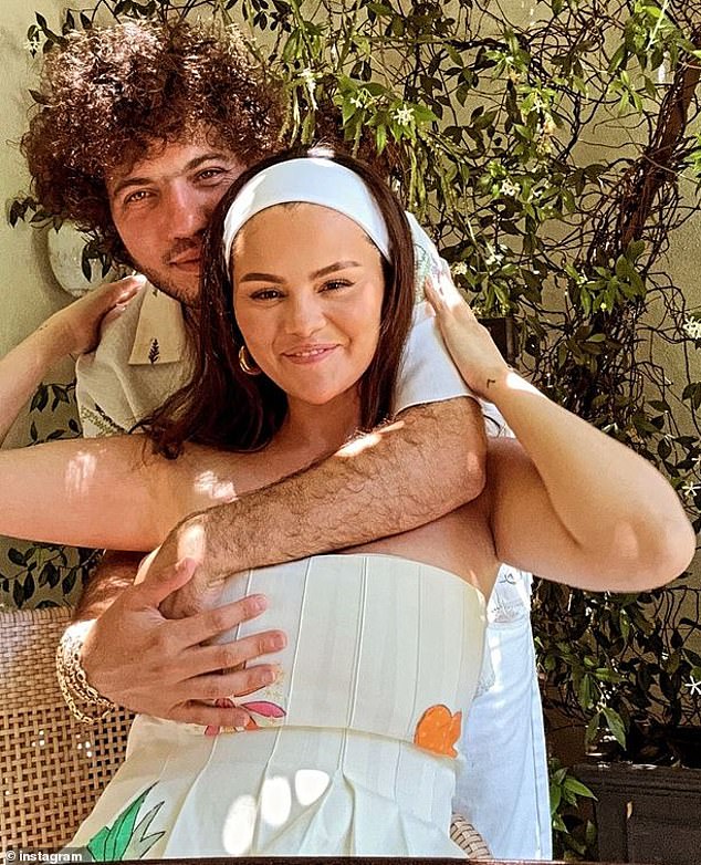 Benny and Selena posed together for a heartwarming Instagram photo in their party outfits, as he took her into a hug from behind