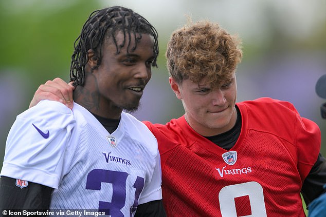 Jackson is pictured with quarterback and fellow draftee JJ McCarthy during rookie camp in May