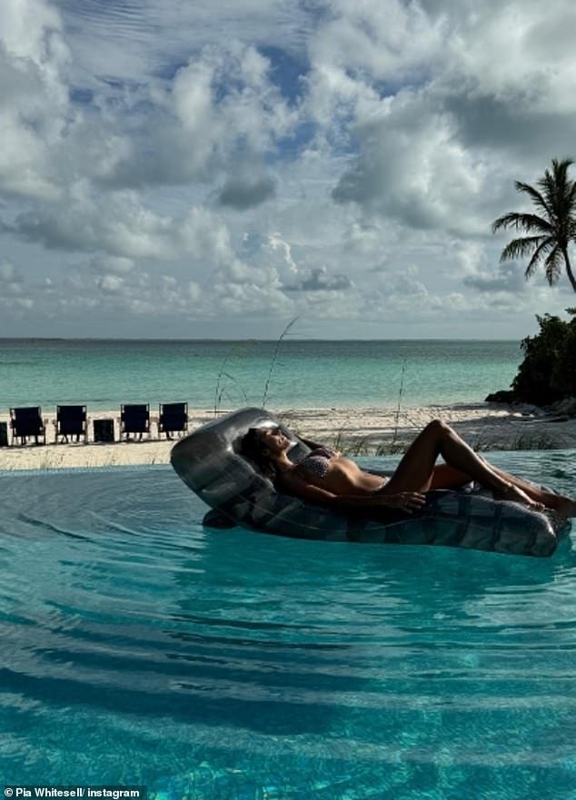 She lounged in the pool on an inflatable lounger before taking a ride in a small boat