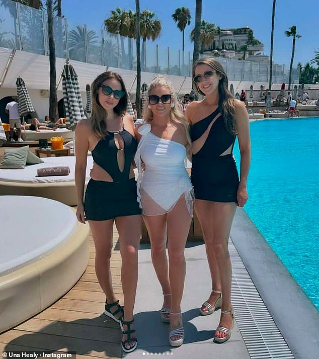 She posed with the bride-to-be who wore a stylish white swimsuit, while all her friends wore black swimsuits