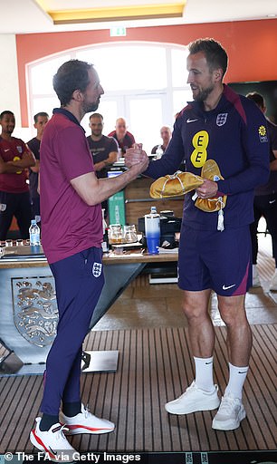 England captain Harry Kane presented Gareth Southgate with a gold cap in recognition of his 100 games as manager of the Three Lions