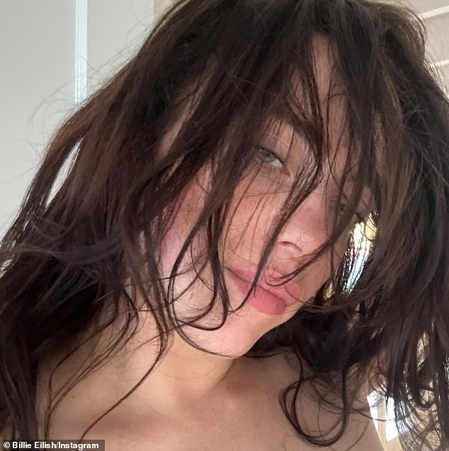 A close-up photo showed the Lunch hitmaker with her dark hair falling over her face