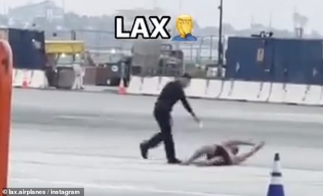 Footage shows the man running as an LAPD officer chases him. He appears to aim his taser at the man, who eventually falls to the ground