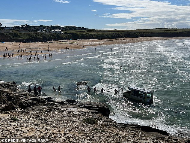 They tried to tow the vehicle out of the water, but in the end the van had to be abandoned