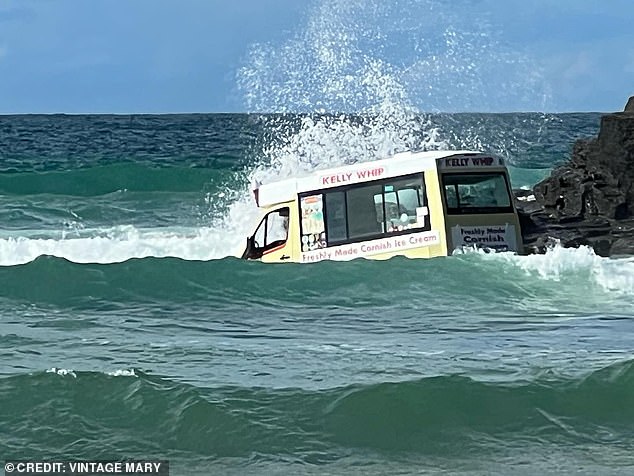 The Kelly Whip bus was seen floating in the water as waves dramatically crashed against it