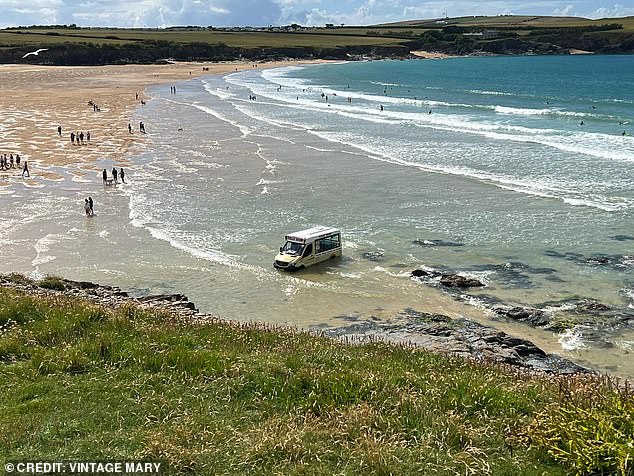 Beachgoers watched as high water swept away the ice cream truck