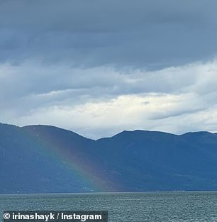 Another photo showed Mother Nature trying to show her beauty by dropping a beautiful rainbow from a cloudy sky into a lake with mountains in the background.