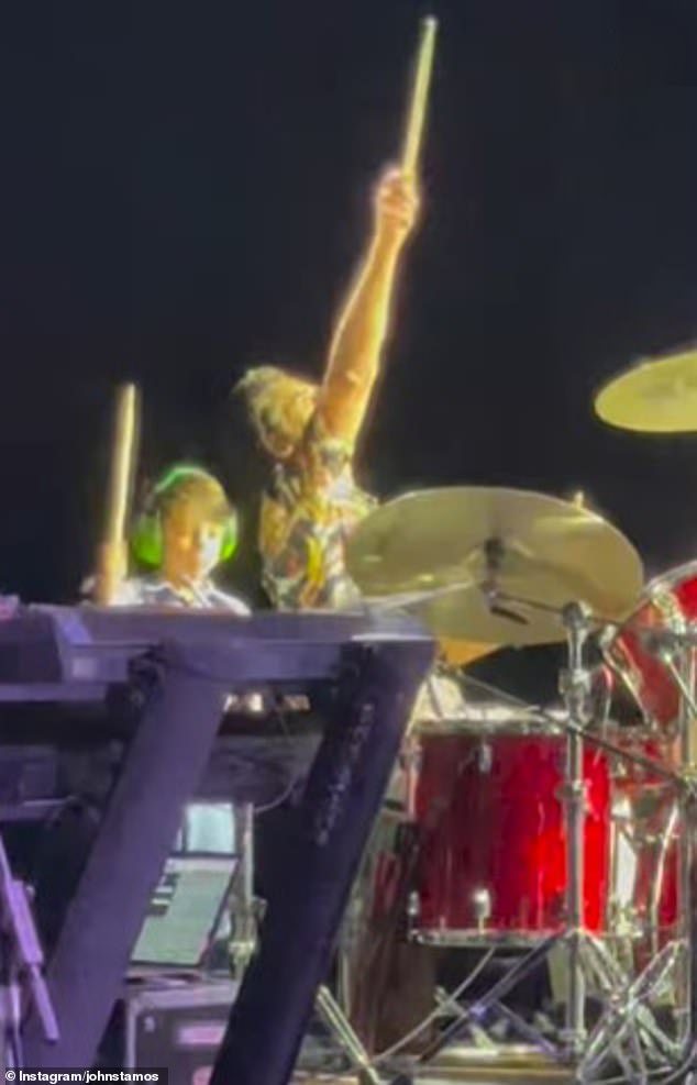 The 60-year-old actor was joined by six-year-old Billy on Friday when he played drums for The Beach Boys at the Meadow Brook Amphitheatre in Michigan