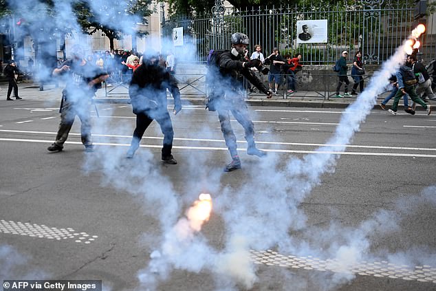 Tear gas is thrown on the street during clashes between security forces and protesters after an election night event following the first results of the second round of the French parliamentary election in Rennes on July 7, 2024