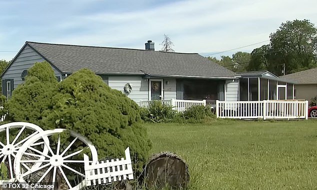 Lloyd's one-story ranch-style home, seen from the side. It has three bedrooms, one bathroom