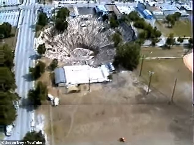 Aerial footage from 1981 shows a large sinkhole in Winter Park, Florida, which caused the collapse of a car dealership, leaving vehicles submerged to this day