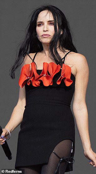 She wore a tiny bandeau LBD with red ruffles attached to it