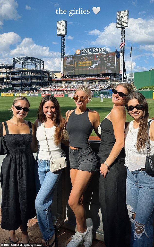 Dunne poses with her fellow Pittsburgh Pirates WAGs players at PNC Park on Saturday afternoon