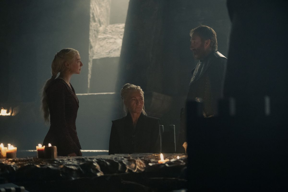 Rhaenys (Eve Best) sits between Rhaenyra (Emma D'Arcy) and one of her advisors during a small council meeting