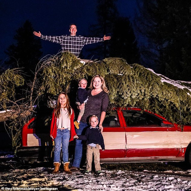 Jeremy Morris is seen with his wife Kristy and his Christmas decorations at his home in Hayden, Idaho. He is involved in a lawsuit with his HOA over the decorations