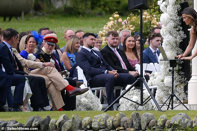 Molly-Mae shares Bambi with her fiancé Tommy Fury, who was also in attendance on the big day in a smart suit (seen centre during the ceremony)