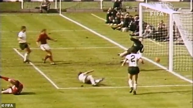 In the photo, Geoff Hurst (bottom left) falls to the ground after taking the shot, as his England team-mate Roger Hunt looks on. After the ball bounced off the pitch, Hunt could have fired the ball into the net to make the goal unambiguous - but he didn't, certain the ball had crossed the line. From this TV camera footage, it looks like Hunt may have been right