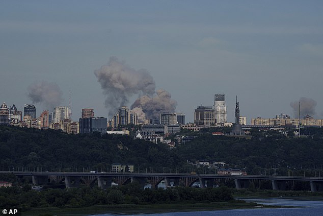 Smoke rises over the Kiev skyline after a Russian attack, Monday, July 8, 2024