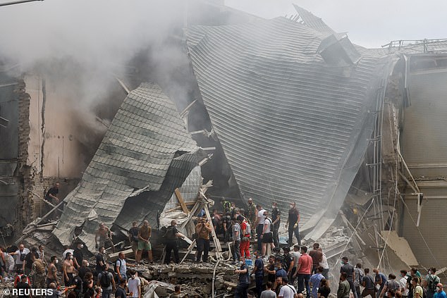 Rescue workers work at the Ohmatdyt Children's Hospital which was damaged in a Russian missile attack, during the Russian attack on Ukraine, in Kiev, Ukraine, July 8, 2024