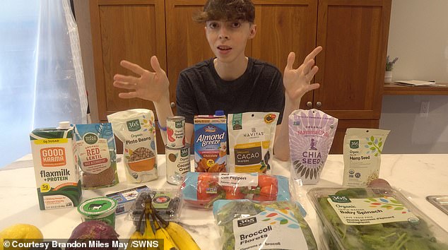 A recent photo of the 35-year-old next to a selection of healthy foods. When he was 15, he started drinking green tea and eating more plant-based foods