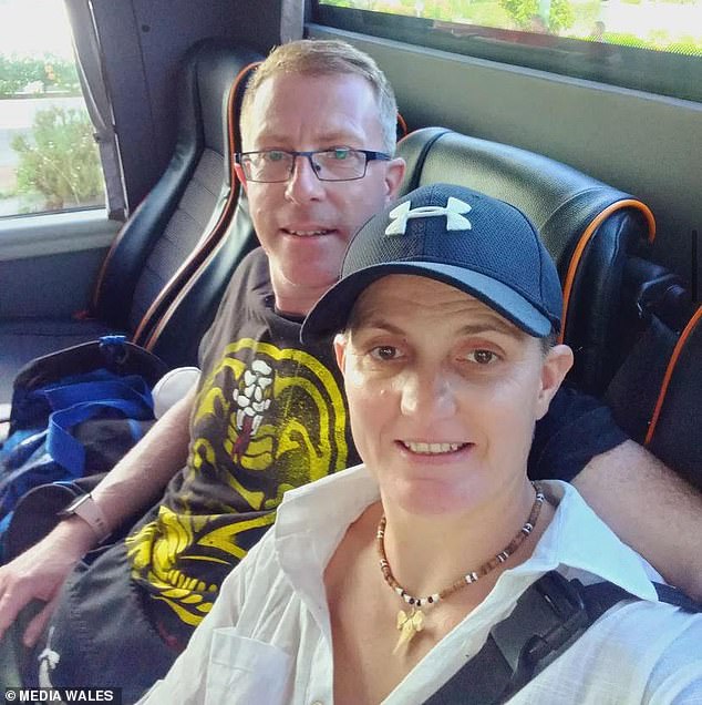 Hooper pictured with her husband Brian Townsend, 47, who also took part in the stalking campaign