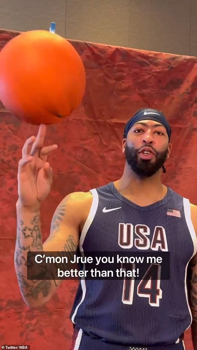 Anthony Davis had no problem spinning a basketball on his finger, proving Jrue Holiday wrong