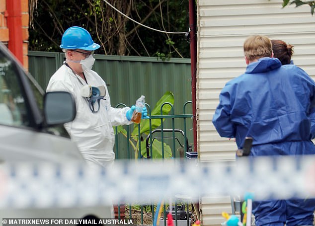 Among the evidence taken from the house were two water bottles containing a tea-like liquid