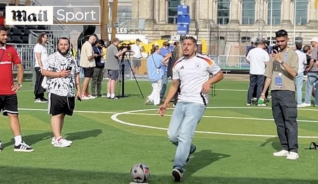 Mail Sport's Aadam Patel (right) challenged fans in Germany to copy Toney's technique