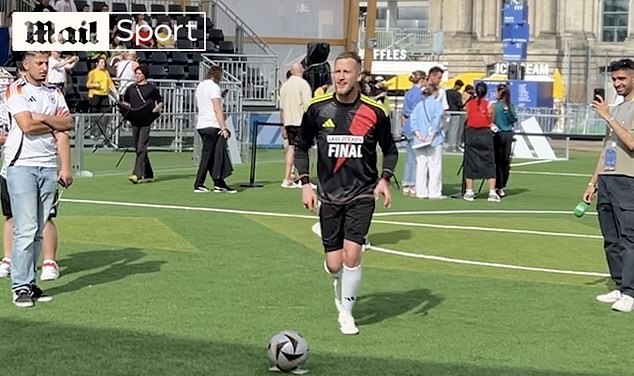 After three fans tried and failed to control their kick without looking at the ball, a left-footer dressed in full football kit finally scored.