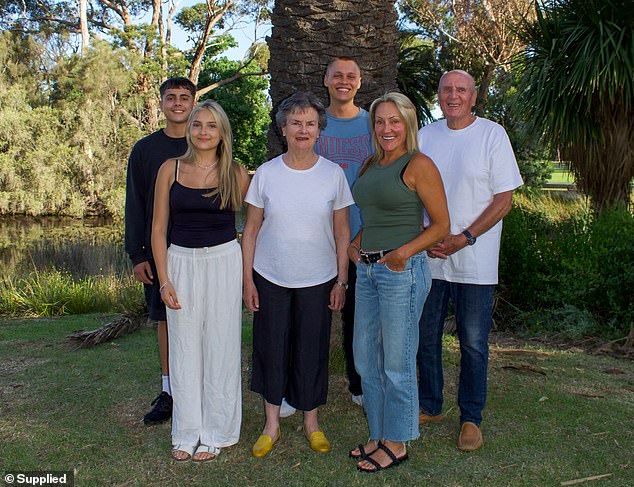 Julia, pictured with her brothers, grandfather and her mother Jen Baressi (front right), was rushed to the intensive care unit of a hospital in Bali and given anti-epilepsy medication before being flown home to Australia and transferred to the Royal Melbourne Hospital.