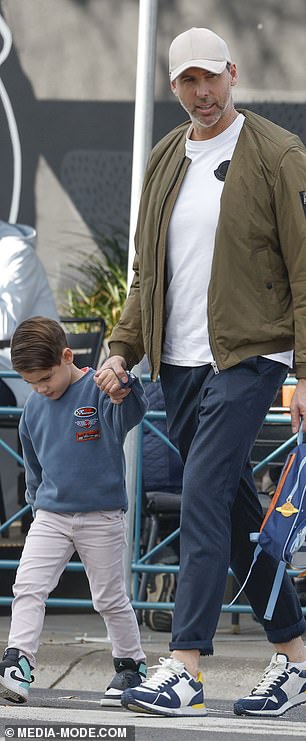 Hackett held his son Eddie's hand