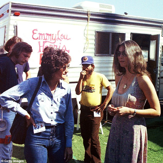 Martin is seen talking to singer and songwriter Emmylou Harris before a show in LA in '75, when she was working for Warner Bros. as a representative and personal advisor