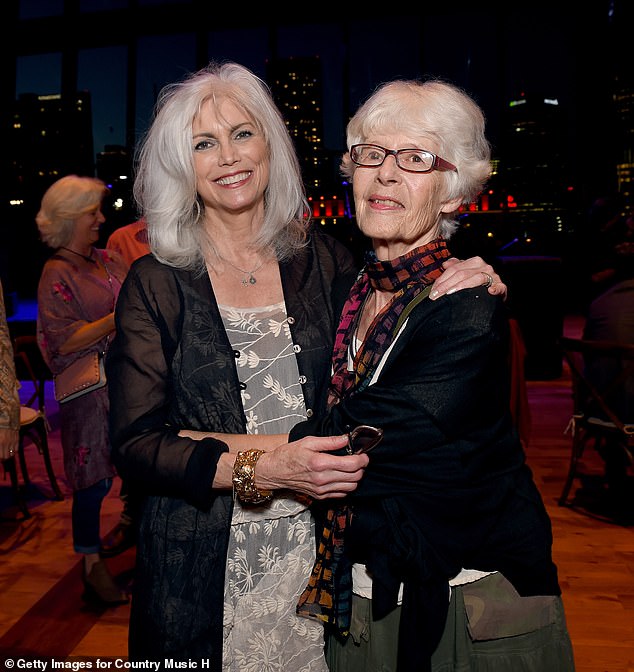 The couple is pictured together again in Nashville in 2018 for Emmylou's debut exhibit at the Country Music Hall of Fame and Museum