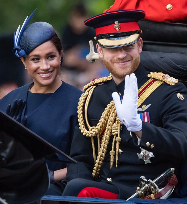 Prince Harry (pictured with Meghan) was 'stunned' by the negative reactions he received after being nominated for the award