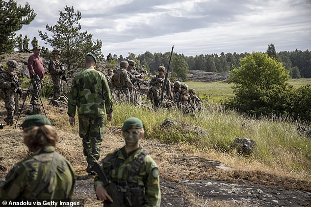 Conscripts from the US Maine Corps and Stockholm's Amphibious Regiment are seen during Baltops 24 military exercises on the island of Uto