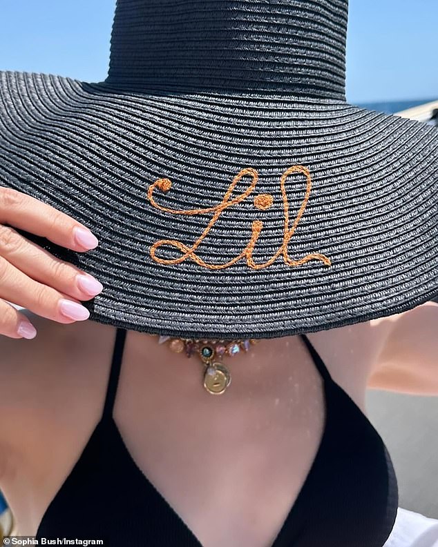 Sophia posed in black bikini bottoms and a matching wide-brimmed sun hat