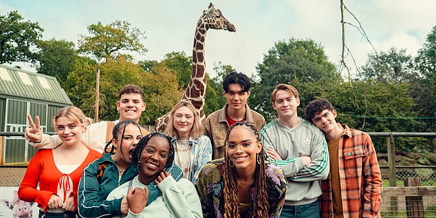 A group photo also shows the cast beaming as they enjoy a day at the zoo