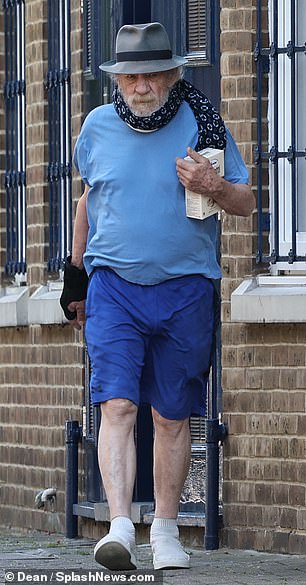 Sir Ian kept a low profile in casual blue shorts and a T-shirt with a hat pulled over his famous face