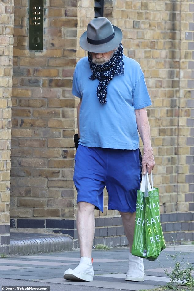 The actor slipped his feet into a pair of comfortable white sneakers