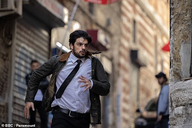 A fugitive from Scotland Yard, Mehmet Suleyman (Ethan Kai) — bound by rules, smart, eager to impress, but shocked by his new boss's unorthodox tactics